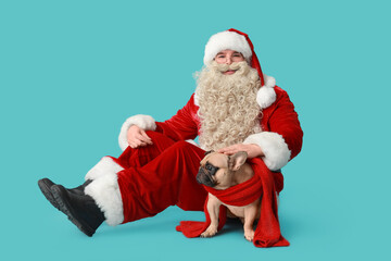 Santa Claus and French bulldog with scarf on blue background