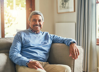 Relax, smile and portrait of old man on sofa in lounge for calm, happiness and retirement. Comfortable, peace and morning with senior person in living room of home for resting and mental health