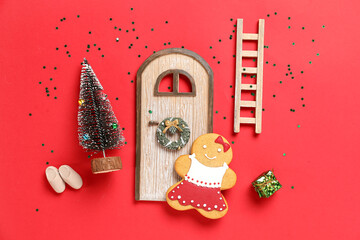 Beautiful composition with gingerbread cookie and different Christmas decorations on red background
