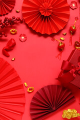 Frame made of gift box. fortune cookies and different Chinese symbols on red background. New Year celebration