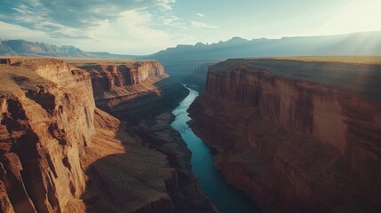 Expansive view of a majestic canyon featuring a river showcasing a stunning natural landscape Essence of natural beauty