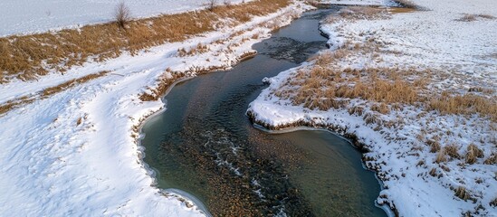 Obraz premium Aerial View Of A Stream In The Winter