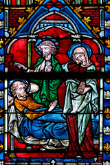 2024-10-16, Auxerre, FRANCE. Stained glass (17th century) of Death of Saint Joseph surrounded by Mary and Jesus.