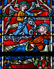 Obraz premium 2024-10-16, Auxerre, FRANCE. Stained glass (17th century) of The dream of Saint Joseph.
