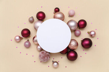 Blank card, Christmas balls and confetti on beige background