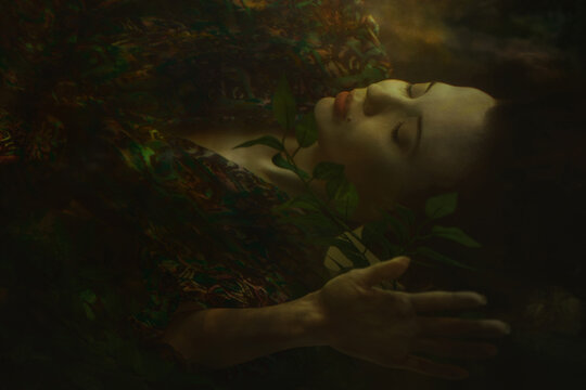 Enchanting underwater portrait of a woman in a fairy theme