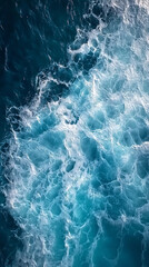 Fototapeta premium Aerial View of Turquoise Ocean Waves Creating Beautiful Patterns in the Water