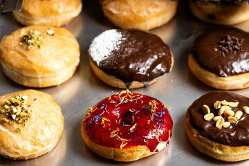 Assorted vegan donuts with diverse fillings and toppings