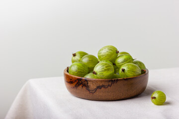 Gooseberry in a wooden bowl