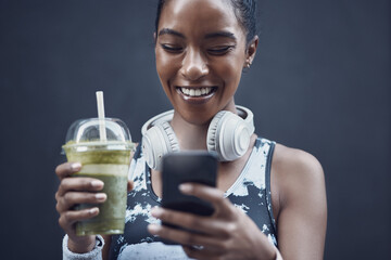 Woman, mobile and healthy smoothie for diet, nutrition and social media with kale, organic liquid...