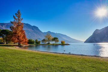 View of the beautiful Lake Garda surrounded by mountains, Riva del Garda town and Garda lake in the autumn time , Trentino Alto Adige region,Italy