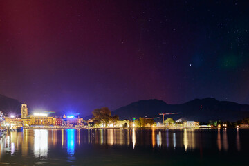 Geomagnetic storm Aurora Borealis and red SAR in Riva del Garda, Lake Garda in October 2024, Italy