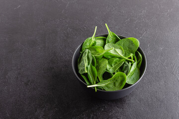 Fresh green spinach leaves in the bowl. Natural vegetarian food.