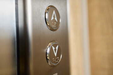 Closeup of elevator buttons in a modern setting, highlighting sleek design and convenience