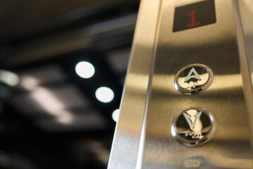 Closeup of elevator buttons in a modern setting, highlighting sleek design and convenience