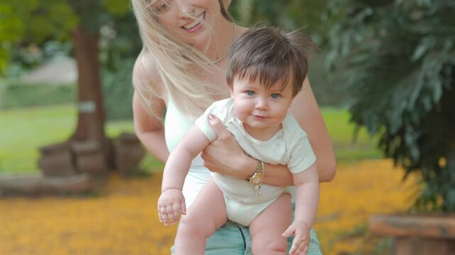 Caucasian mom and son hanging out at park