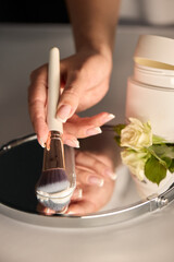 An Elegant Spa Setup Featuring a Beautiful Bowl, Fresh Flowers, and Essential Skincare Tools