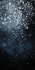 Abstract image depicting scattered particles against a dark background, suggesting depth and motion.