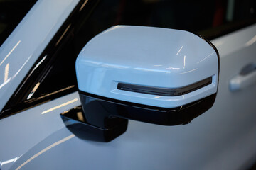 Obraz premium An elegant closeup shot of a sleek car side mirror showcasing its design and details
