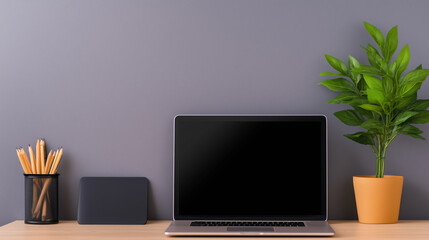 modern workspace featuring laptop, plant, and stationery items. clean and organized setup promotes productivity and creativity, ideal for work or study.