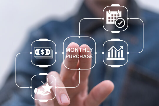 Man working on virtual touch screen presses inscription: MONTHLY PURCHASE. Monthly Purchase Business Finance concept.