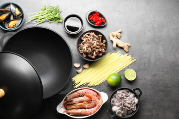 Ingredients for wok on grey table, flat lay