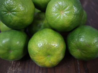 fresh food background of  green tangerines design for healthy diet