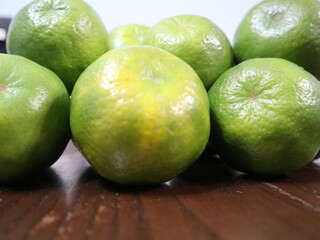 fresh food background of  green tangerines design for healthy diet