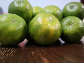 fresh food background of  green tangerines design for healthy diet