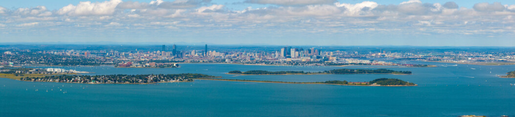 Fototapeta premium Boston Back Bay and Financial District skyline and Boston Harbor panoramic aerial view including Moon Island and Thompson Island from Quincy Bay, Boston, Massachusetts MA, USA. 