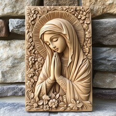 Naklejka premium Wooden Carving of Praying Madonna with Floral Decoration