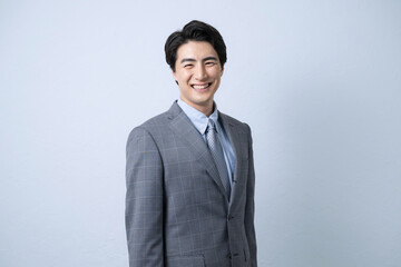 ビジネスのスーツを着たハンサムな男性の上半身