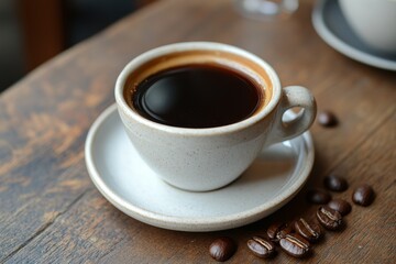 Fototapeta premium Freshly Brewed Coffee in White Mug on Wooden Table with Coffee Beans