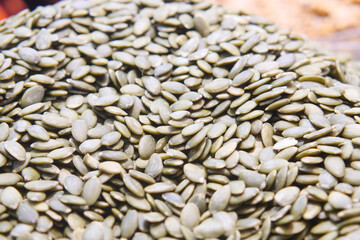A CloseUp Image of Raw Green Pumpkin Seeds Beautifully Arranged on Display for Viewing