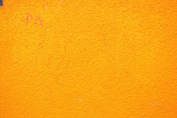 A Vibrant Orange Textured Wall Background Ideal for Various Creative Projects and Designs