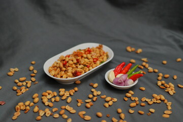 Nuts and spices chili and onion on black background for product, educational and other purposes