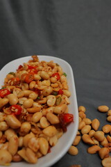 Nuts and spices chili and onion on black background for product, educational and other purposes