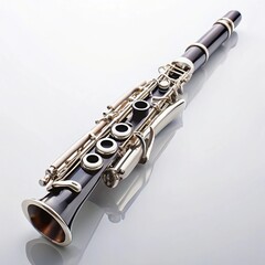 Fototapeta premium Black and silver clarinet on reflective white surface