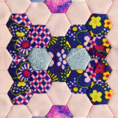 Pattern of hexagon quilt blocks sewed together to make a blanket.