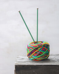 Knitting wool. Bright colored yarn with knitting needles.
