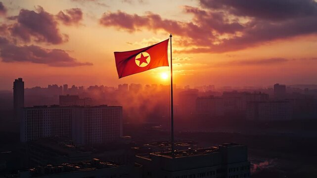 The North Korean flag flies proudly in the sunset over Pyongyang
