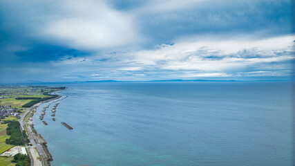 Offshore wind turbines, breakwaters, windbreak forests, etc. on the coastline facing Toyama Bay in Japan