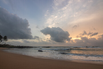 Landscape by the sea. Long deserted beach with water views to the horizon. The waves of a storm...
