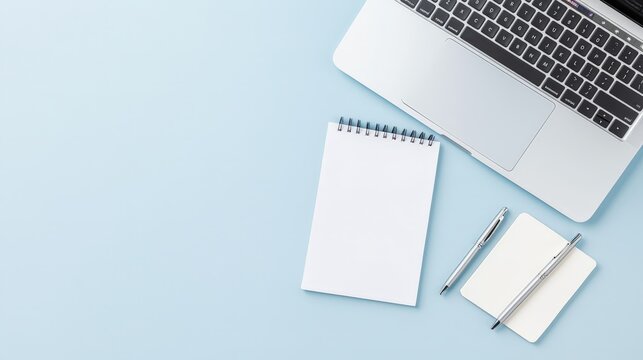 Minimal Workspace, Laptop and Notepad on Blue