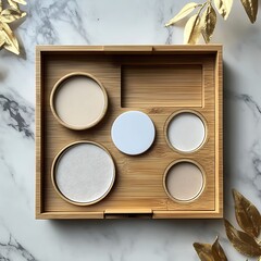 Bamboo Makeup Palette with Golden Leaf Decor on Marble Background.