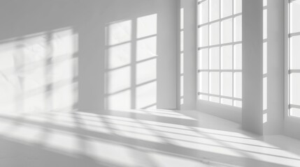 Minimalist interior with sunlight casting shadows through large windows. Calm and serene atmosphere