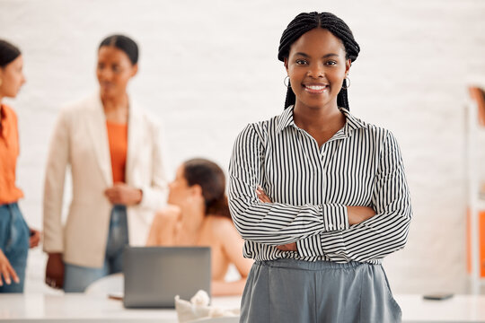 Happy, crossed arms and portrait of businesswoman in office with team for fashion career at startup. Smile, confident and African female clothing designer with pride for leadership at workshop.