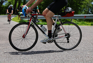 Fototapeta premium racing bike with cyclist doing a cycle touring route on the roads