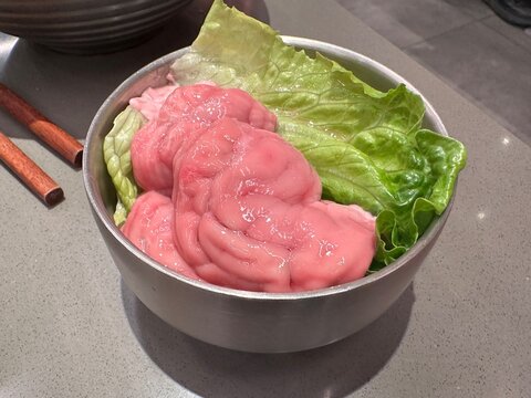 Fresh pig brain ready for hot pot. One of Chinese hot pot ingredient. Chengdu, Chongqing, Sichuan hot pot