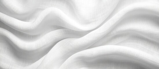 Obraz premium White fabric background with soft folds and waves.